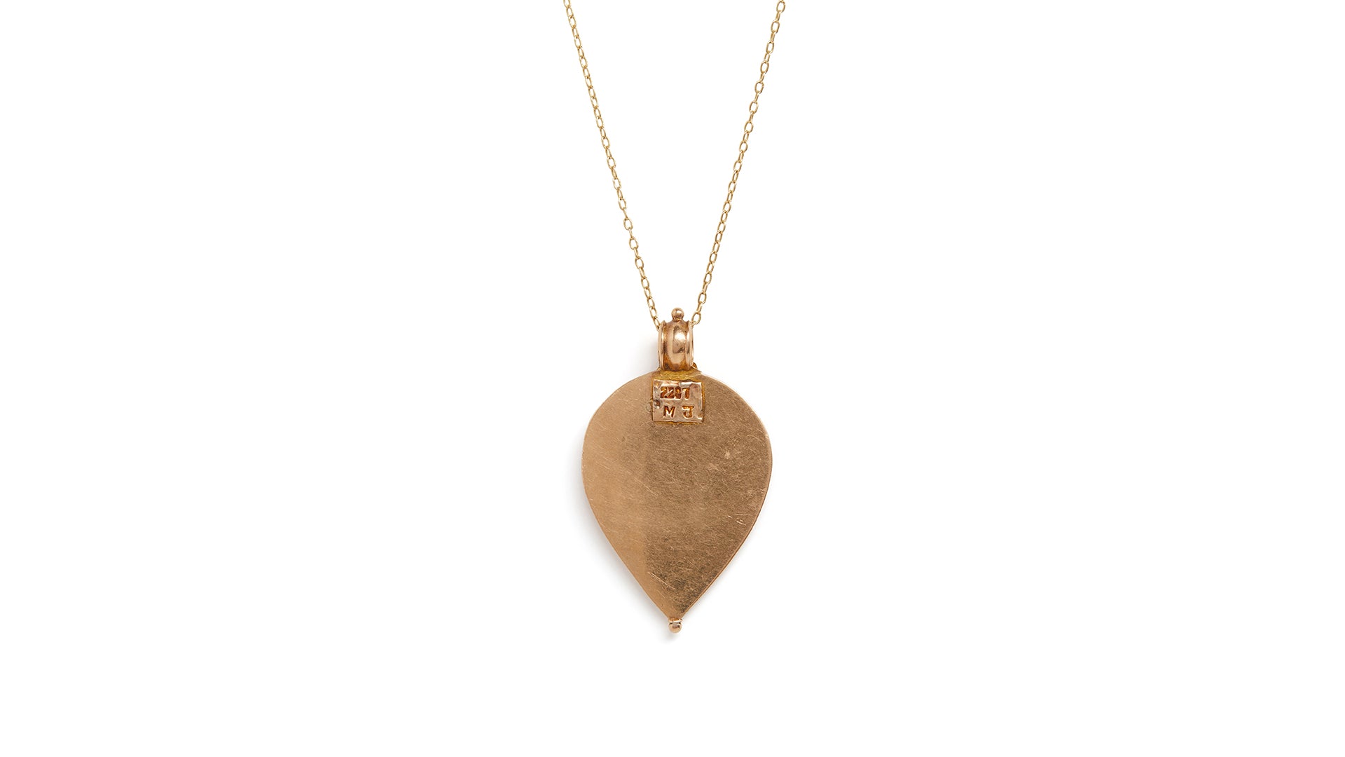 Backside of gold amulet necklace with Goddess Laxmi pendant against a plain white background