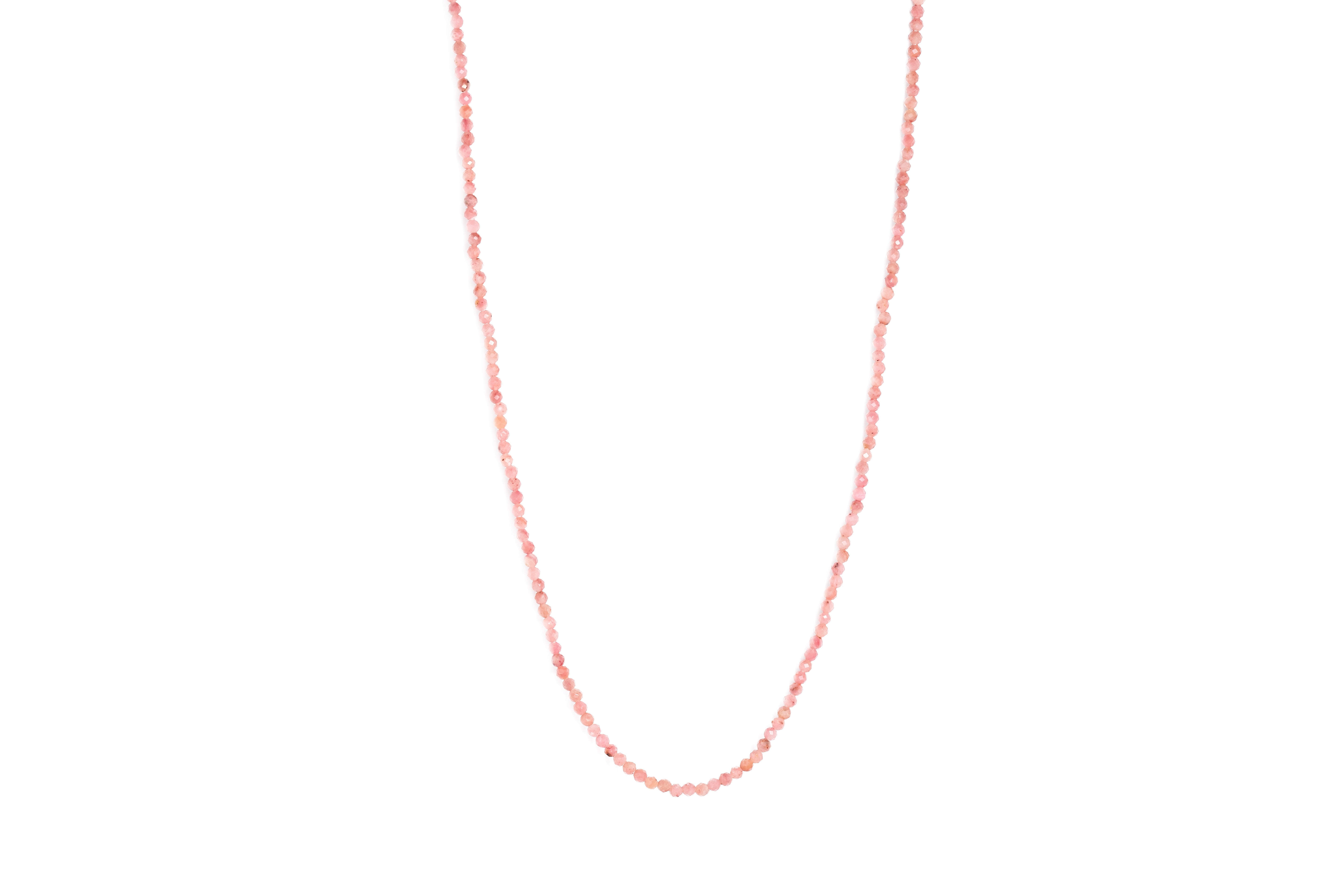 A pink rhodochrosite crystal bead necklace with an 18ct gold clasp, displayed against a white background.