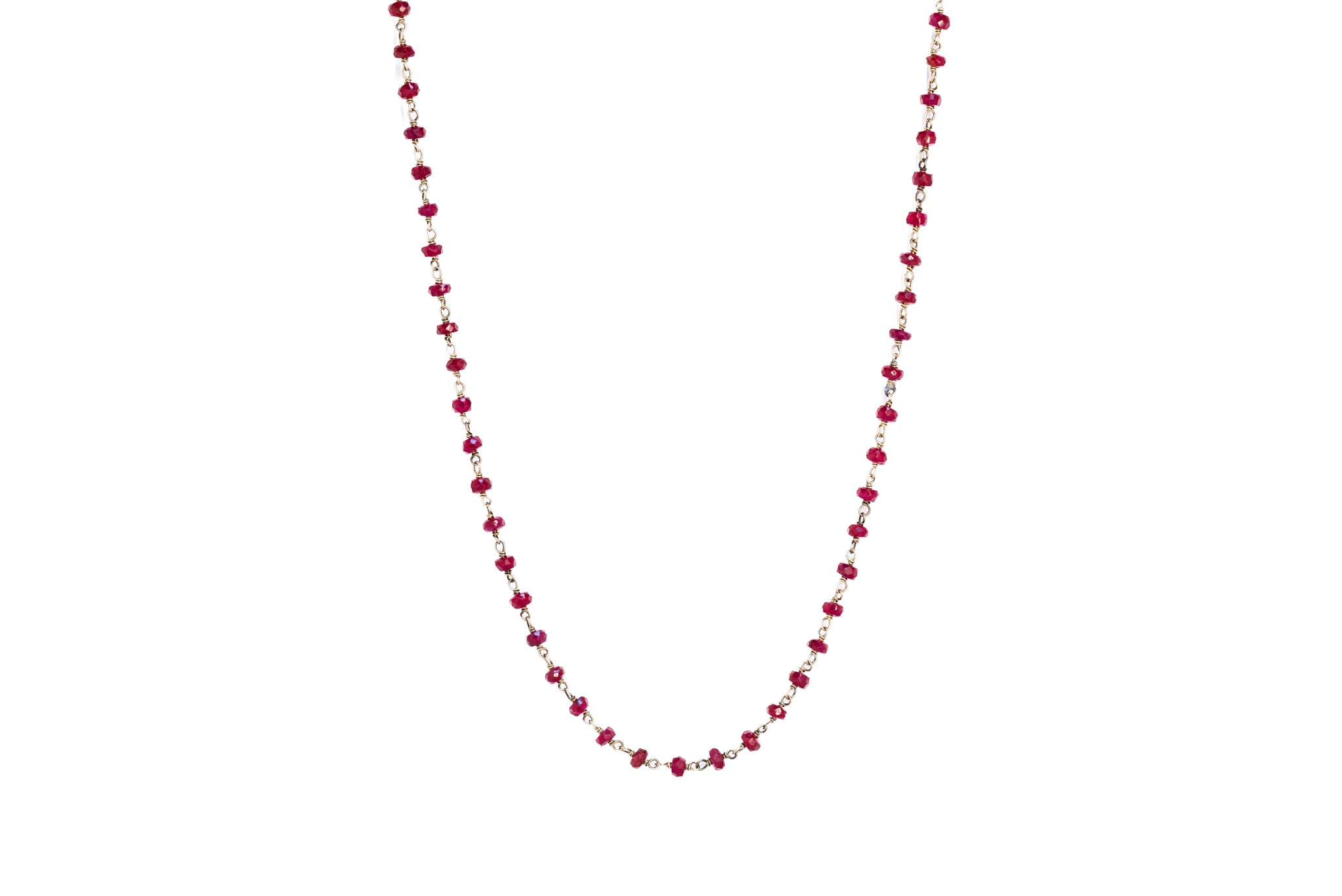 A Beaded ruby necklace on a plain white background