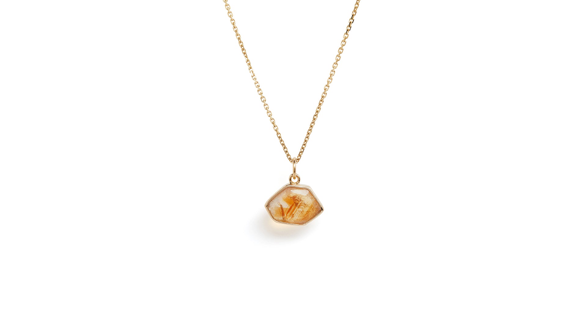 The citrine window amulet necklace with gold chain against a white background