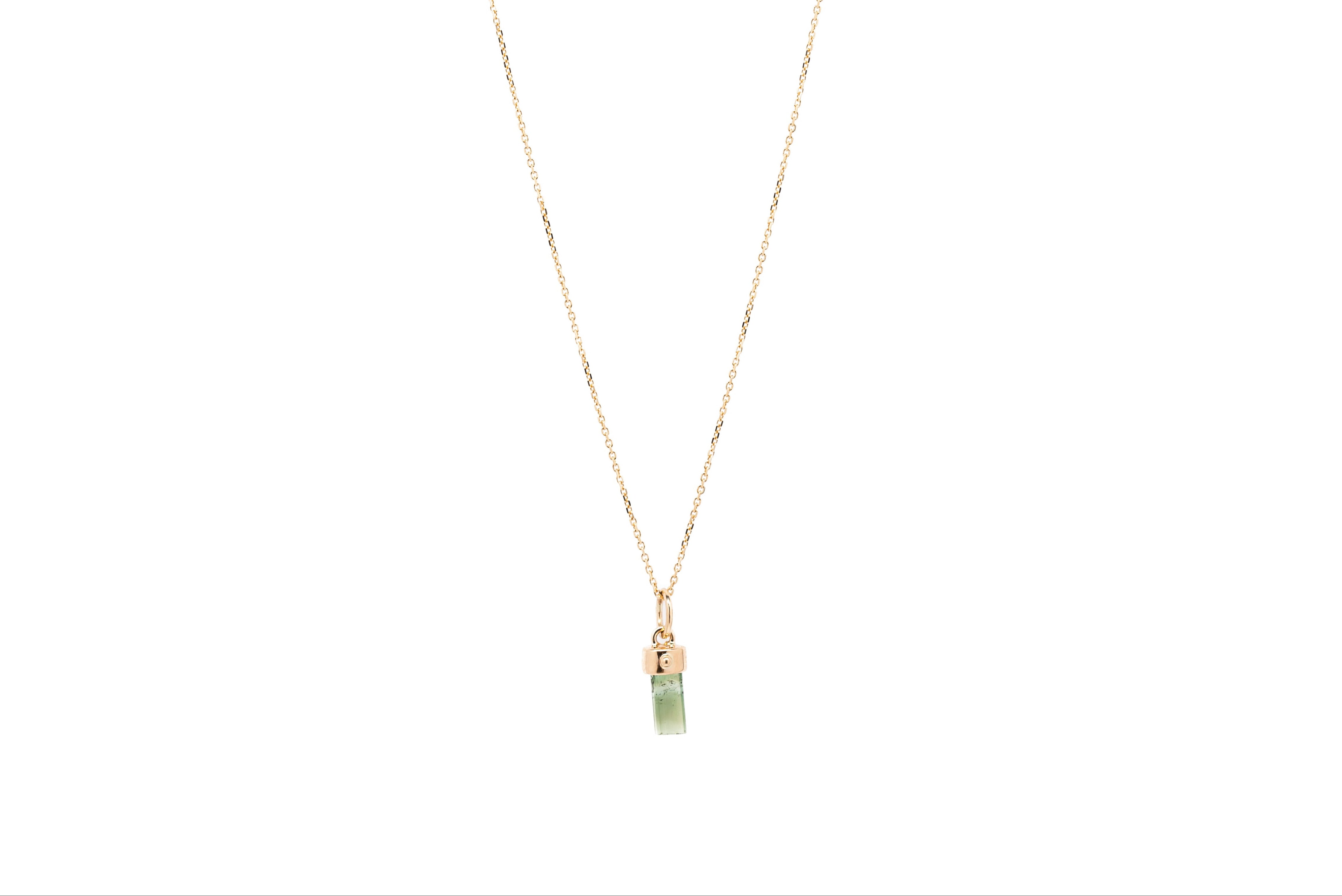 Green tourmaline amulet necklace on white background