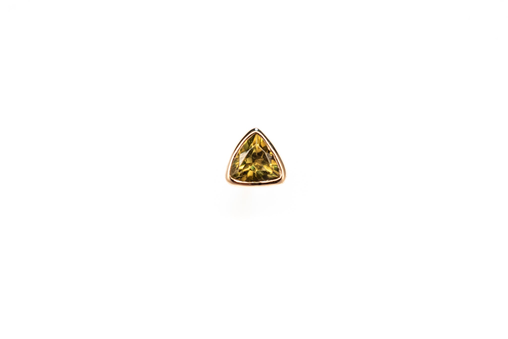 A green tourmaline 18ct gold stud against a white background
