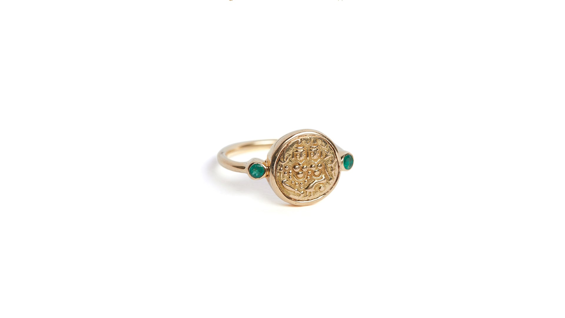 'Union' gold coin ring with emeralds depicting Hindu deities Shiva and Parvati