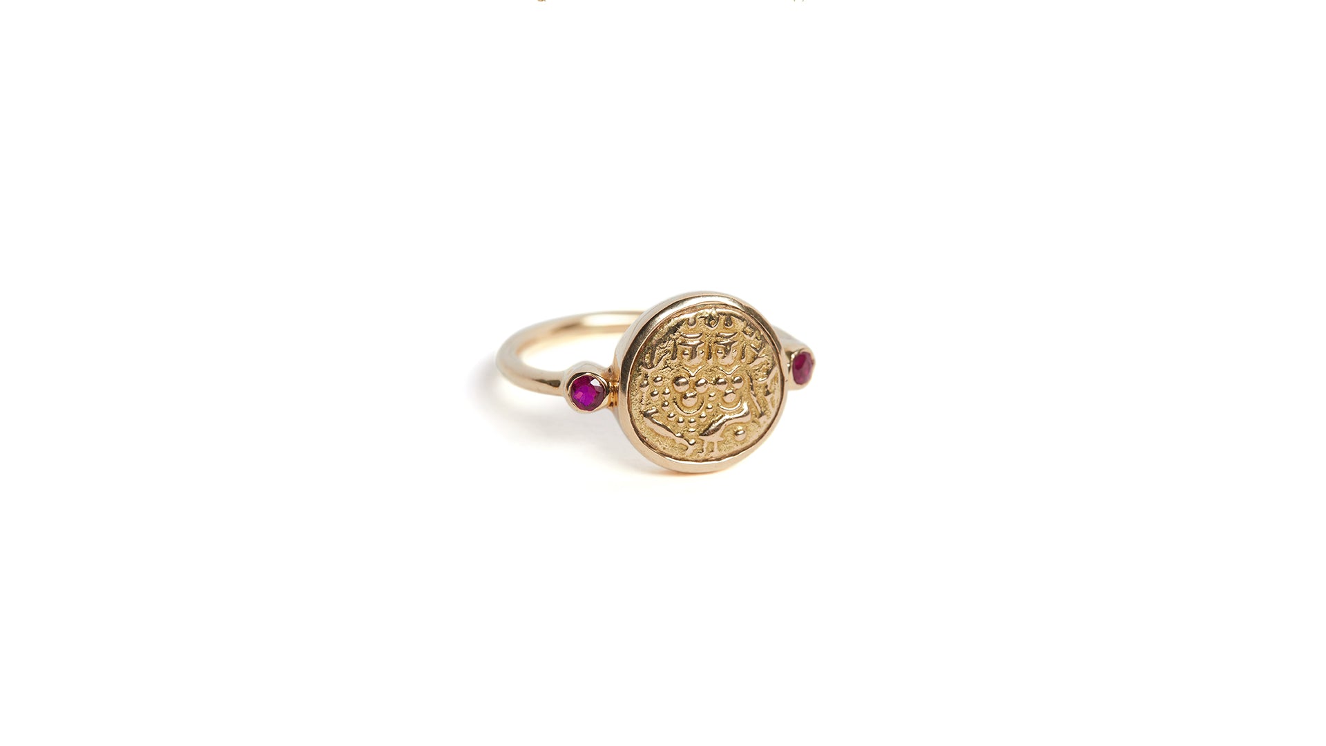 'Union' gold coin ring with rubies depicting Hindu deities Shiva and Parvati on a white background